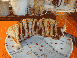 a sliced cinnamon roll showing the layers of dough and cinnamon